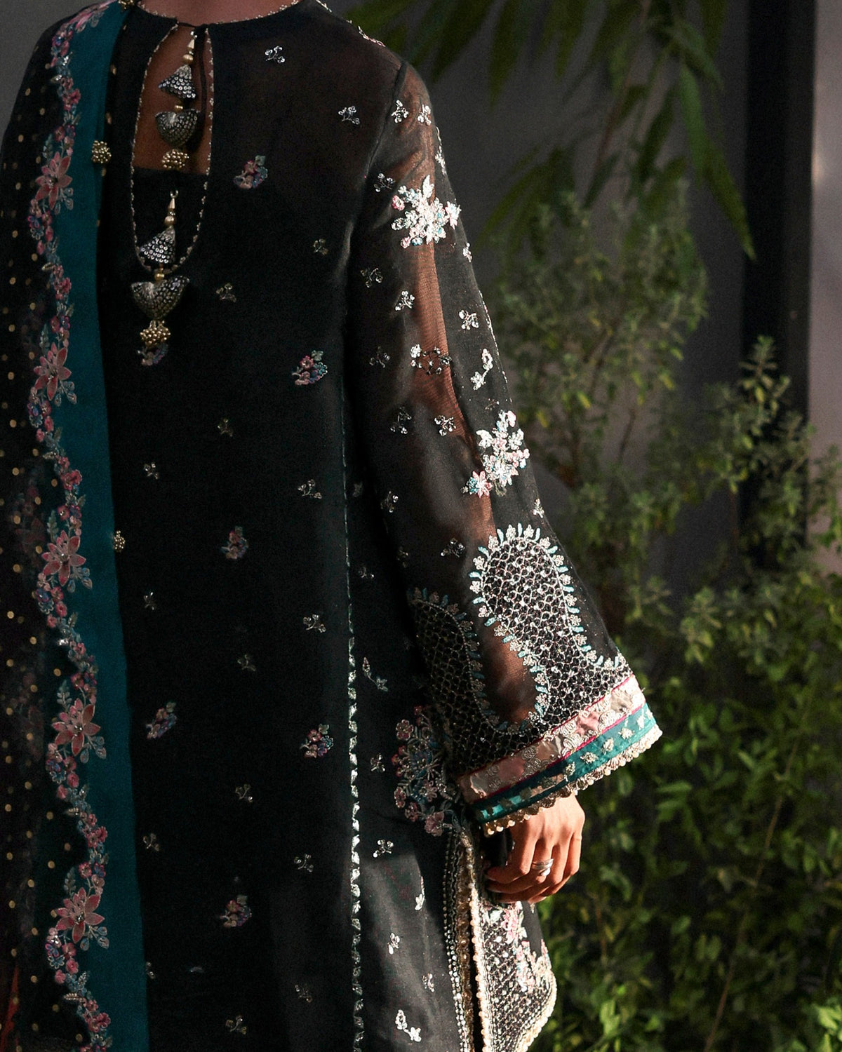 - Rich black Khaadi net with multi-panel embroidery
