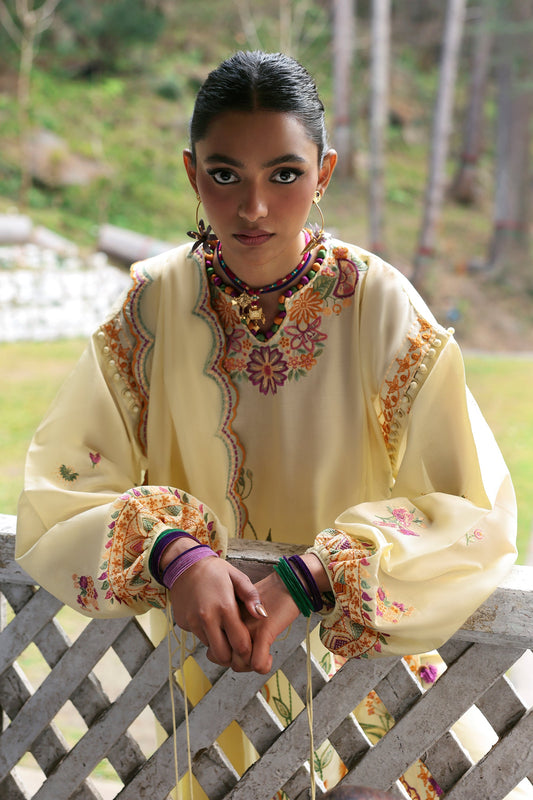 Unstitched embroidered lawn suit with voile dupatta and cambric trousers—ideal for festive wear and summer fashion.