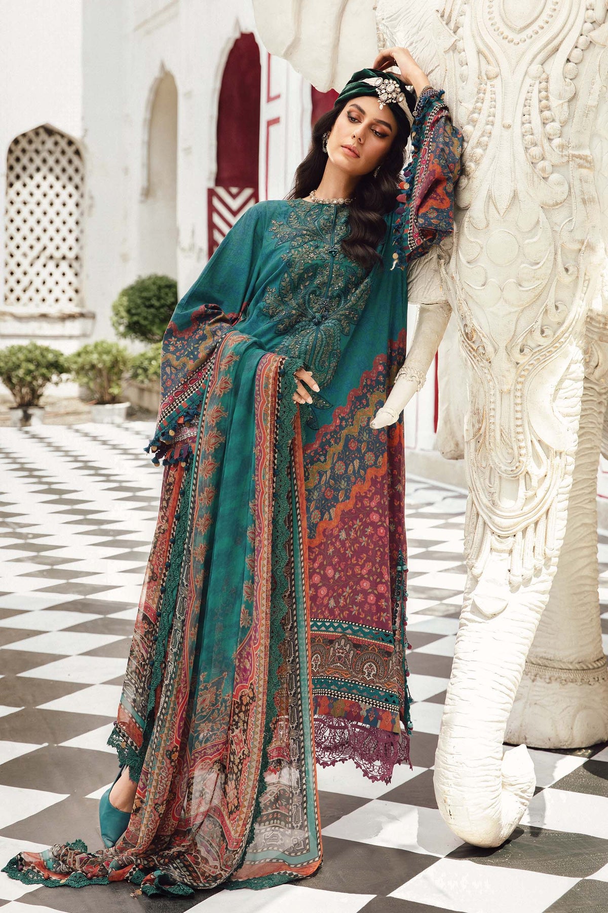 - Model in Maria B MPrint Fall/Winter outfit featuring warm tones and wool shawl
