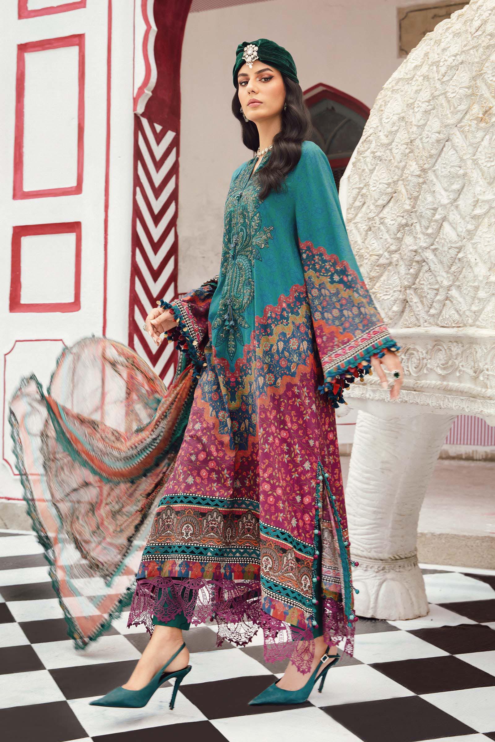 - Model in Maria B MPrint Fall/Winter outfit featuring warm tones and wool shawl
