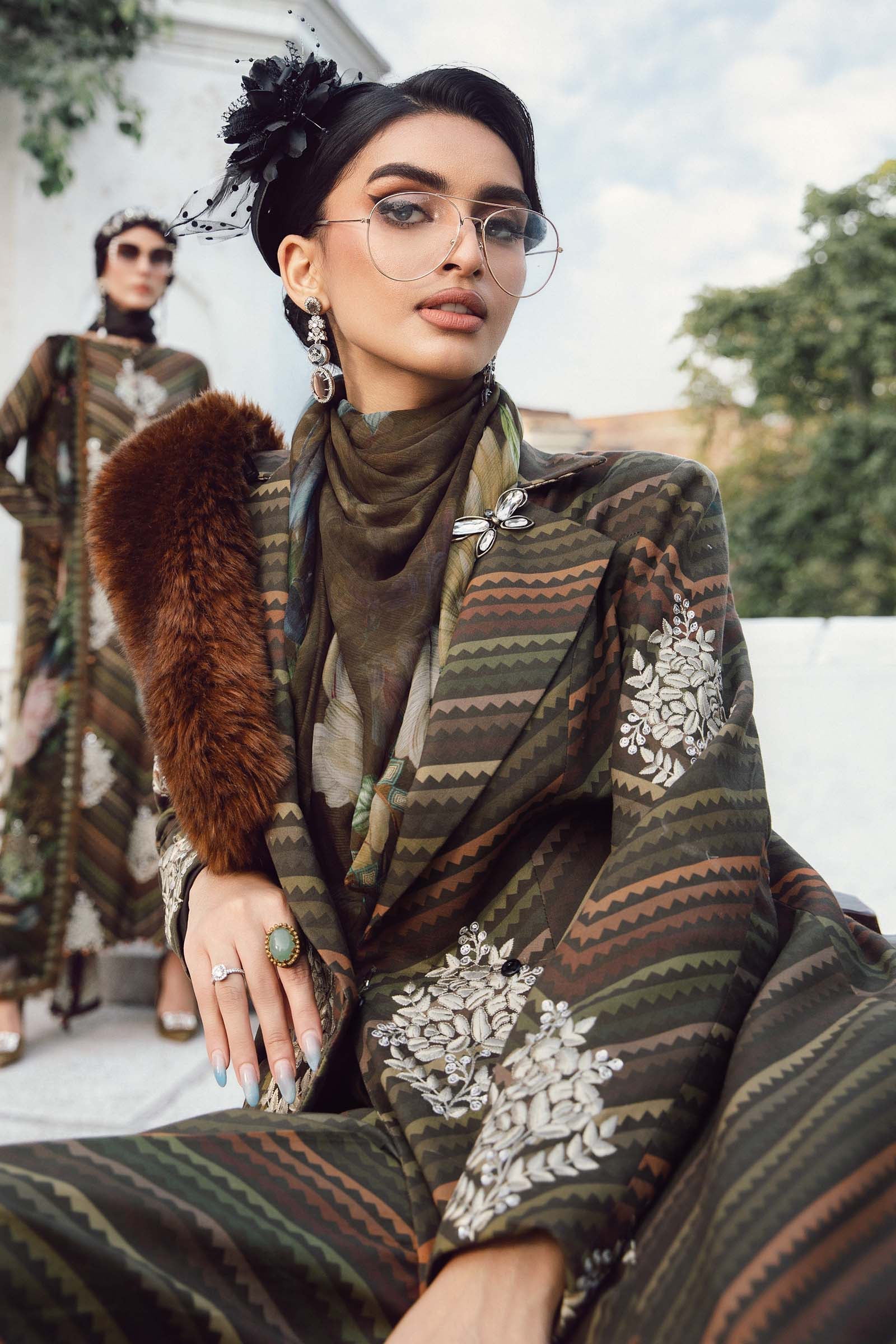 	Unstitched Maria B MPrint Fall/Winter 3-piece suit in warm tones with wool shawl and festive design